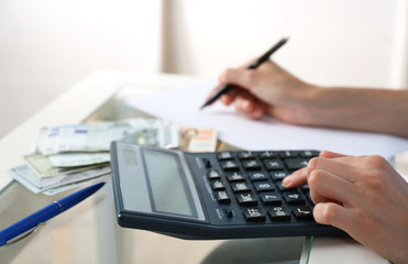 Fototapeta na wymiar Accounting concept.Analyzing finance report with calculator