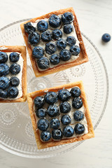 Gourmet fresh blueberry tarts on plate, close up
