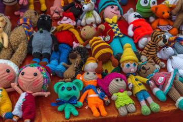 Fototapeta na wymiar Knitted toy doll