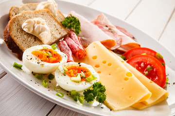 Breakfast - boiled egg, bacon, cheese and vegetables 