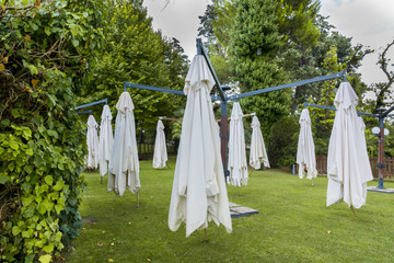 Outdoor reception area with parasols empty after a brief summer storm