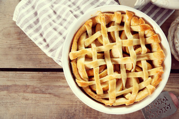 Homemade apple pie on wooden background