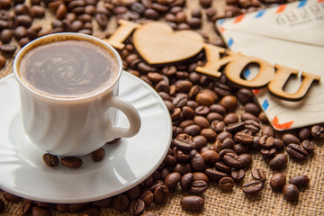 cup of coffee and a letter on the table