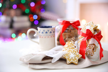 Christmas cookies and cup of tea, on table at home