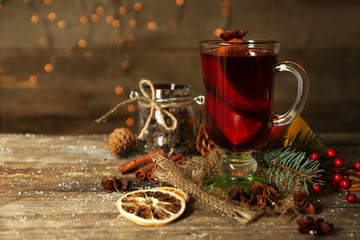 Beautiful Christmas composition of mulled wine on decorated wooden table