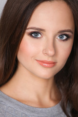 Fototapeta premium Portrait of an attractive fashionable young brunette woman