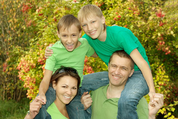 Fototapeta premium family of four walking 