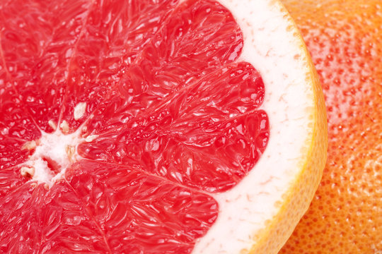 half of red fruit of grapefruit , close up