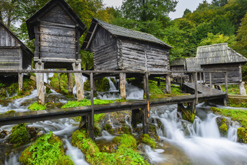 Fototapeta na wymiar Old wooden water mills, Jajce in Bosnia and Herzegovina