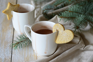 Cocoa drink with hanging mug cookies