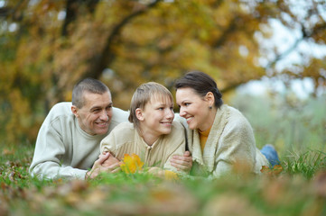 smiling family in forest