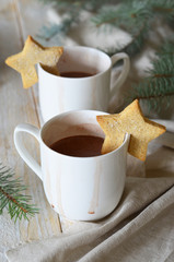 Cocoa drink with hanging mug cookies