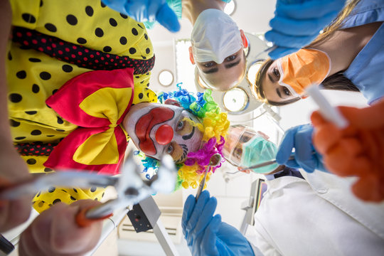 Bottom view of dental team with clown