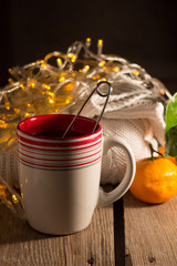 Cup of tea, pullover, tangerine