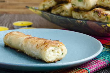 Fried rolls of pita with cheese
