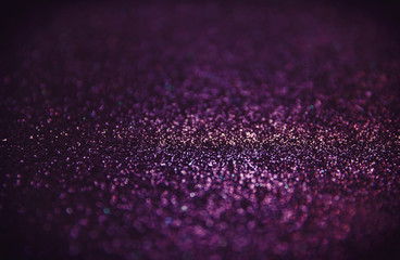 abstract glitter purple lights background

