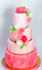 Pink wedding cake isolated on white background. Handmade Wedding
