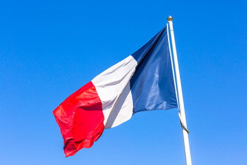 Naklejka na ściany i meble French flag against blue sky