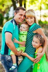 Fototapeta premium Happy family in the park. Happiness.