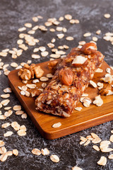 Healthy granola bar on wooden background