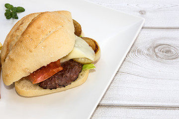 Burger with cheese, tomato, lettuce