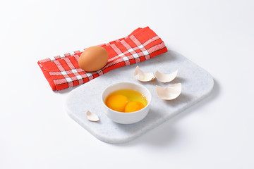 Egg whites and yolks in bowl