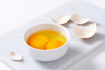 Egg whites and yolks in bowl