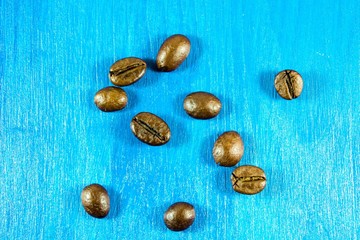 Coffee beans isolated on wooden background