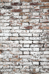 Old large red brick wall background distressed with white paint