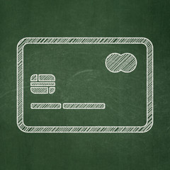 Finance concept: Credit Card on chalkboard background