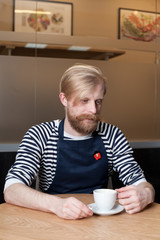 Handsome bearded man in cafe