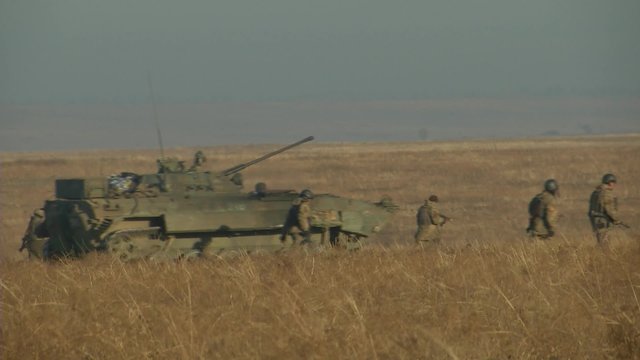 Infantry fighting vehicle on the batlefield. Military armored vehicles training