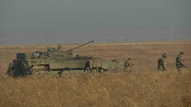 Infantry fighting vehicle on the batlefield. Military armored vehicles training