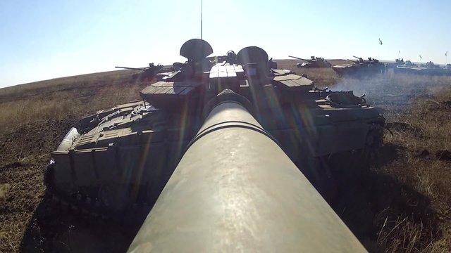 Tank with camera on the large-calibre cannon is rotating its gun turret over 360.Military armored vehicles training