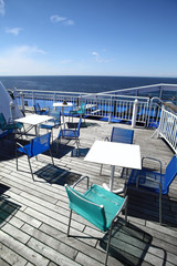 Chairs and tables on a ferry deck