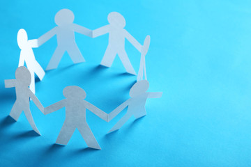 Paper people on the blue paper background