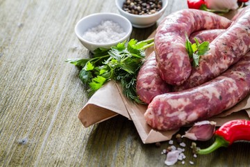 Raw sausages  with herbs and spices