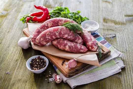 Raw sausages  with herbs and spices
