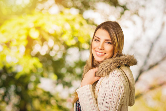  Beautiful young woman in beige sweater