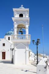 Oia Orthodox church and the bell tower on Santorini island, Greece.