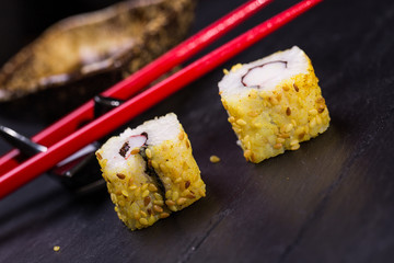 Closeup of fresh sushi on rustic wooden table