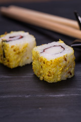 Closeup of fresh sushi on rustic wooden table