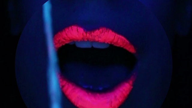 Woman face with fluorescent make up , creative makeup great for nightclubs , Halloween party,  shows and music video 
