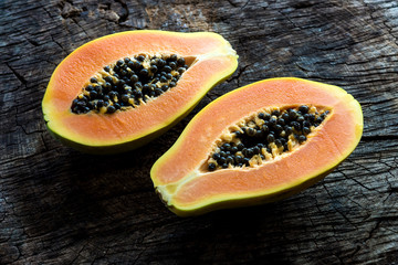 Papaya on wooden background