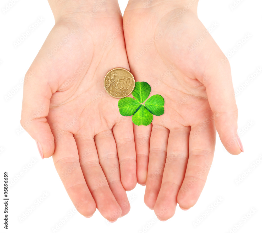 Wall mural clover leaf and euro coin in hand isolated on white