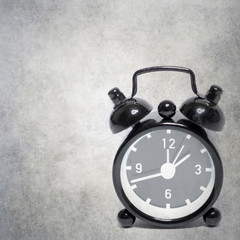 old alarm clock on old background texture