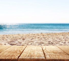 Fototapeta na wymiar Wooden planks on beach background
