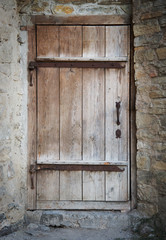 old wooden door in a stone wall