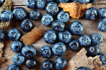 Tasty ripe blueberries on wooden table close up
