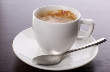 Cup of coffee on table close up